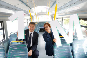 1 Million passengers Anne Graham Minister Eamon Ryan sitting inside bus