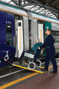 person in wheelchair getting on iarnrod Eireann_Heuston Station 400x600