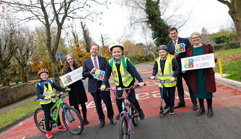 SRTS ROUND 3 - 3 kids on bicycles Minister Eamon Ryan, NTAs Finola O'Driscoll, Minister of State James Lawless